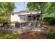Exterior of home featuring a patio with an outdoor kitchen, grilling area, and seating at 7501 Tipsy Sq, Wake Forest, NC 27587