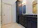 Modern bathroom with granite countertop vanity and stone tile floors at 7501 Tipsy Sq, Wake Forest, NC 27587