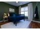 Comfortable bedroom featuring a navy bed and decor with lots of natural light at 7501 Tipsy Sq, Wake Forest, NC 27587