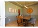 Stylish dining room featuring a long wooden table with bench seating and eye-catching wall decor at 7501 Tipsy Sq, Wake Forest, NC 27587