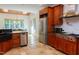 Gourmet kitchen featuring custom cabinets, stone counters, and stainless steel appliances at 7501 Tipsy Sq, Wake Forest, NC 27587