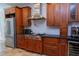 Gourmet kitchen with stainless steel appliances, custom cabinetry, and modern fixtures at 7501 Tipsy Sq, Wake Forest, NC 27587
