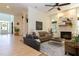 Bright and open living room featuring a stone fireplace, hardwood floors, and comfortable seating arrangements at 7501 Tipsy Sq, Wake Forest, NC 27587