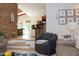 Cozy living area with exposed brick, comfortable seating, and a bright, open atmosphere at 7501 Tipsy Sq, Wake Forest, NC 27587