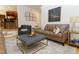 Inviting living room features stylish furnishings, a patterned rug, and decorative artwork at 7501 Tipsy Sq, Wake Forest, NC 27587