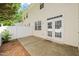 The patio has a white privacy fence and is adjacent to the house, with dual doors at 8253 Martello Ln, Raleigh, NC 27613