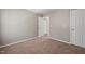 Bedroom features neutral walls, carpet, and access to a closet and other rooms at 8253 Martello Ln, Raleigh, NC 27613
