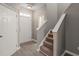 Foyer entrance featuring staircase and coat closet adjacent to the front door at 8253 Martello Ln, Raleigh, NC 27613