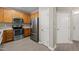 Kitchen with stainless steel appliances and wood cabinets, offering ample storage at 8253 Martello Ln, Raleigh, NC 27613