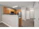 Spacious kitchen with stainless appliances, wood cabinetry, and open floor plan at 8253 Martello Ln, Raleigh, NC 27613