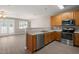 Bright kitchen area open to the living space and stainless steel appliances at 8253 Martello Ln, Raleigh, NC 27613