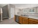 Open kitchen area featuring stainless steel dishwasher and double sink at 8253 Martello Ln, Raleigh, NC 27613