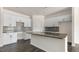 Bright kitchen with stainless steel appliances, granite counters, and a modern backsplash at 826 Old Tarboro Rd, Wendell, NC 27591