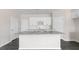 Bright kitchen with large granite island and stainless steel appliances at 827 Old Tarboro Rd, Wendell, NC 27591
