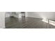 Spacious open-concept layout featuring wood-look floors, a kitchen and living room at 829 Old Tarboro Rd, Wendell, NC 27591