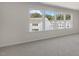 Bright bedroom with multiple windows offering scenic views of the surrounding neighborhood at 834 Old Tarboro Rd, Wendell, NC 27591