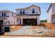 Exterior view of a home under construction, featuring Tyvek HomeWrap and a rough-graded yard at 836 Ottawa Dr, Garner, NC 27529