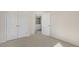 Carpeted bedroom features an ensuite bathroom and a closet, providing comfort and convenience at 837 Old Tarboro Rd, Wendell, NC 27591