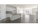 Modern kitchen features white cabinets, a granite-topped island, and stainless steel appliances at 837 Old Tarboro Rd, Wendell, NC 27591