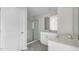 Bathroom featuring a glass door shower, a vanity with dual sinks and storage space at 839 Old Tarboro Rd, Wendell, NC 27591