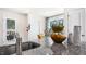 Kitchen island with stone countertops, stylish decor, and ample natural light from nearby windows at 8544 Beckett Chase Way, Raleigh, NC 27616