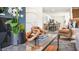 Bright living room has an open layout with view of the kitchen and staircase at 8548 Beckett Chase Way, Raleigh, NC 27616