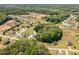 An aerial view of a neighborhood with properties featuring large lots and lush greenery at 91 Carsons Creek Trl, Wendell, NC 27591