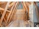 Exposed beams in an unfinished attic space with plywood and a HVAC system at 91 Carsons Creek Trl, Wendell, NC 27591