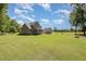 Expansive backyard with lush lawn and mature trees create a private outdoor space at 91 Carsons Creek Trl, Wendell, NC 27591
