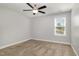 Neutral-toned bedroom with carpet, a window, and fan at 91 Carsons Creek Trl, Wendell, NC 27591