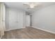 Cozy bedroom with plush carpet, ceiling fan, and spacious closet for ample storage at 91 Carsons Creek Trl, Wendell, NC 27591