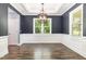 Elegant dining room with a tray ceiling, wainscoting, and natural light at 91 Carsons Creek Trl, Wendell, NC 27591