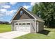 Detached garage offering ample parking and storage space, complementing the home's exterior at 91 Carsons Creek Trl, Wendell, NC 27591