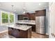 Modern kitchen with granite counters, stainless steel appliances, and pendant lighting at 91 Carsons Creek Trl, Wendell, NC 27591