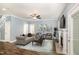 Cozy living room with modern furniture, a fireplace, and stylish decor at 91 Carsons Creek Trl, Wendell, NC 27591