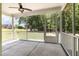 Relaxing screened porch overlooking a serene backyard with mature trees and lawn at 91 Carsons Creek Trl, Wendell, NC 27591