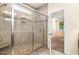 A walk-in shower features decorative tiles, a built-in bench, and a frameless glass door at 91 Carsons Creek Trl, Wendell, NC 27591