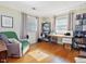 Bedroom offers natural light and hardwood floors, with ample space for a home office setup at 945 St Marys St, Raleigh, NC 27605