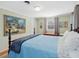 Well-lit bedroom showcasing a bed, artwork, and cozy decor for relaxation at 945 St Marys St, Raleigh, NC 27605