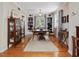 Elegant dining room with hardwood floors, built-in bookshelves, and a chandelier at 945 St Marys St, Raleigh, NC 27605