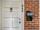 Close up of a townhouse front door showing architectural details and brick accents at 945 St Marys St, Raleigh, NC 27605