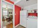Compact kitchen with modern appliances, bright red walls, and plenty of cabinet space at 945 St Marys St, Raleigh, NC 27605