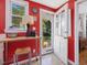 Bright kitchen area featuring an exposed view of the back yard, white cabinets and red walls at 945 St Marys St, Raleigh, NC 27605