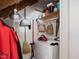 Functional laundry area with a washer, storage, and utility accessories at 945 St Marys St, Raleigh, NC 27605