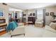 Cozy living room featuring hardwood floors, neutral colors, comfortable seating, and dining area at 945 St Marys St, Raleigh, NC 27605