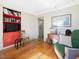 Relaxing living room featuring hardwood floors, built in shelving, and ample natural light at 945 St Marys St, Raleigh, NC 27605