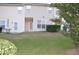 Private fenced backyard with a well-maintained lawn and mature landscaping offers a serene outdoor retreat at 958 Shining Wire Way, Morrisville, NC 27560