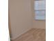 Bright bedroom with neutral carpet and a large window at 958 Shining Wire Way, Morrisville, NC 27560
