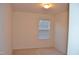 Bright bedroom features neutral walls and carpet, and a window for natural light at 958 Shining Wire Way, Morrisville, NC 27560