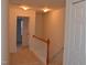 Hallway with neutral walls and carpet, with access to rooms at 958 Shining Wire Way, Morrisville, NC 27560